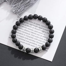 Cargar imagen en el visor de la galería, La Pulsera de piedra volcánica personalizada, con cuentas negras y cuatro separadores plateados, luce un diseño poroso tipo lava; es el regalo perfecto para papá y una pulsera especial para el Día del Padre.
