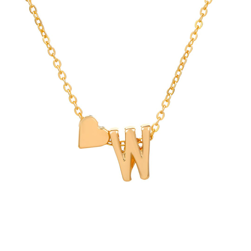 Un collar de oro con una fina cadena tiene un colgante en forma de W y un pequeño dije de corazón a la izquierda, perfecto para combinar con la Pulsera de tobillo con inicial en dorado. El fondo es blanco liso.