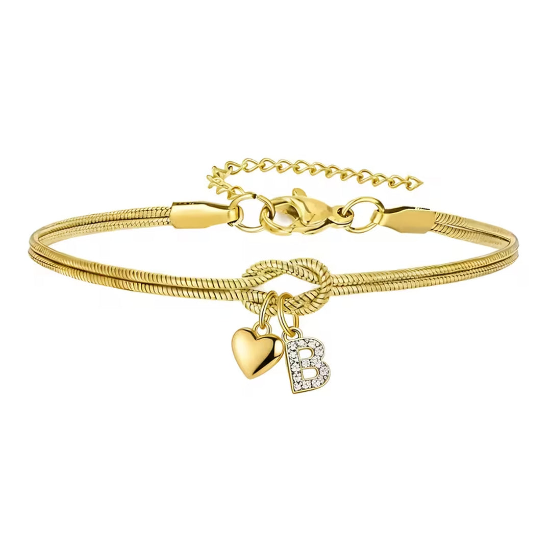 Pulsera dorada con inicial y dije de corazón