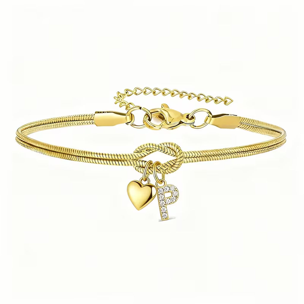 Pulsera dorada con inicial y dije de corazón