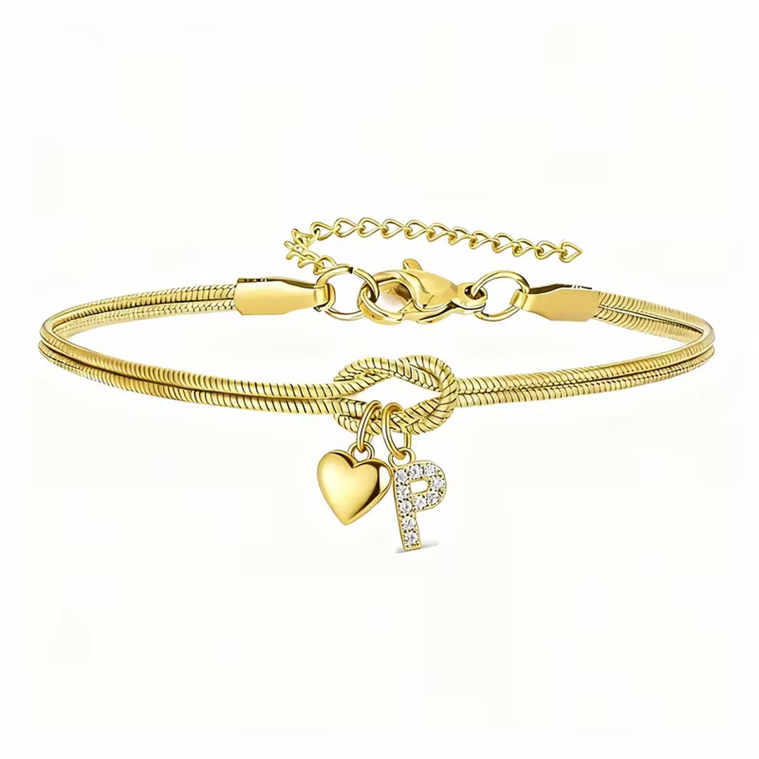 Pulsera dorada con inicial y dije de corazón