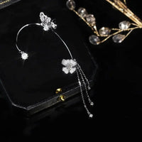 Aretes Mariposa pompón sin perforación - Moroveta