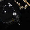 Aretes Mariposa pompón sin perforación - Moroveta