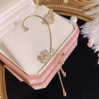 Aretes Mariposa pompón sin perforación - Moroveta