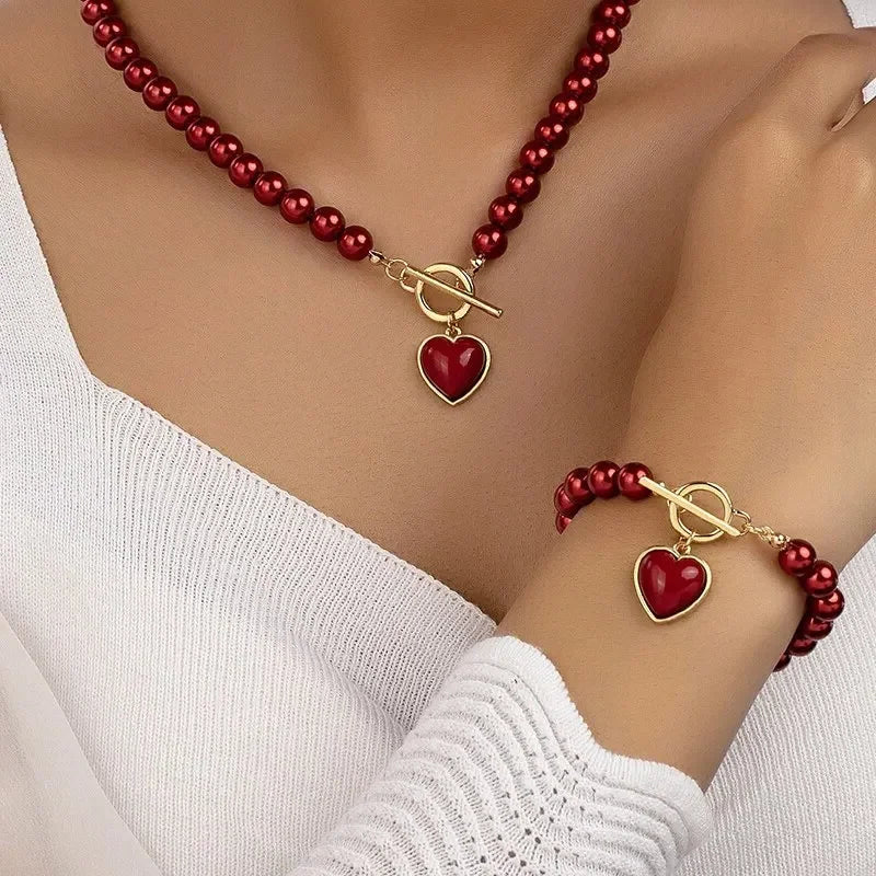 Conjunto de pulsera y collar con colgante de corazón de perlas