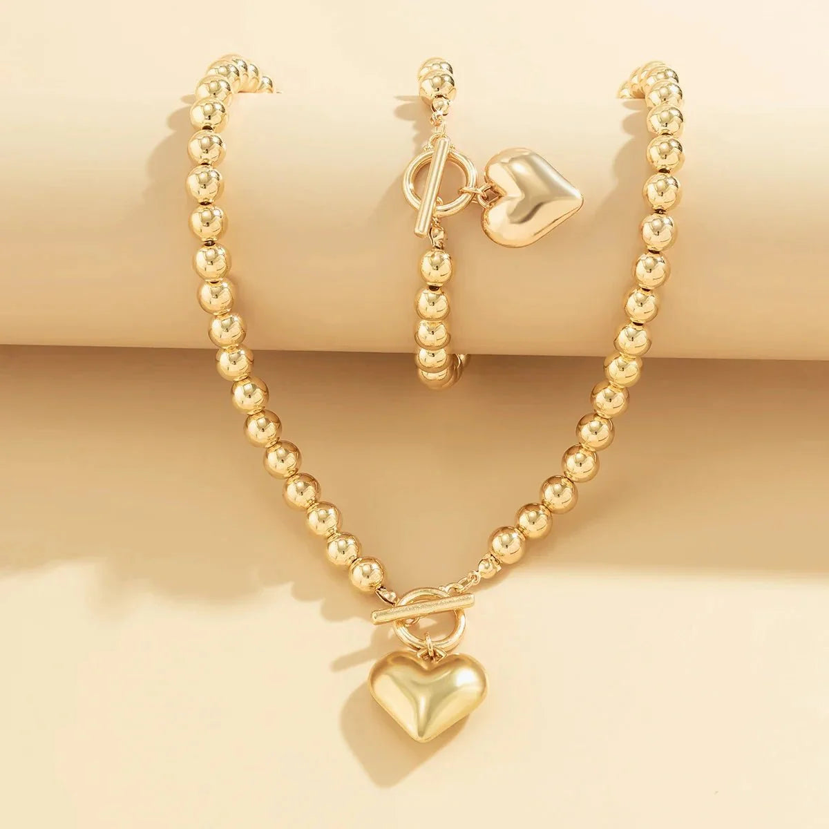 Conjunto de pulsera y collar con colgante de corazón de perlas