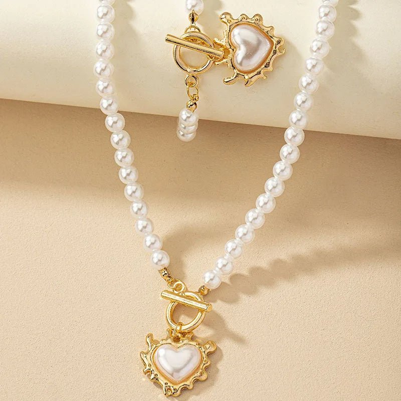 Conjunto de pulsera y collar con colgante de corazón de perlas