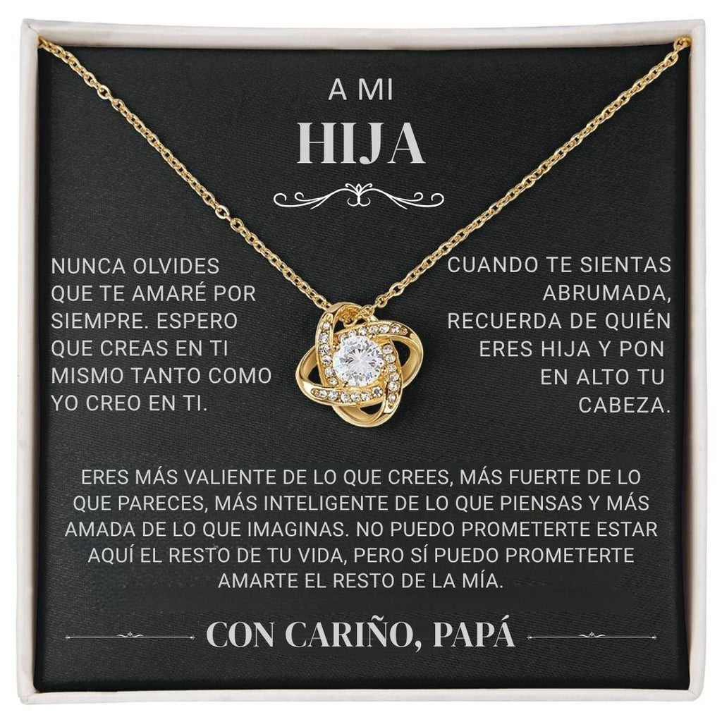 El "Collar 'A mi hija' - Con cariño Papá" es un collar de oro con un colgante brillante en una caja negra, con un sentido mensaje en español de padre a hija que expresa amor, ánimo y orgullo.