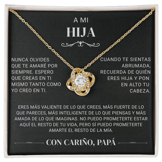 El "Collar 'A mi hija' - Con cariño Papá" es un collar de oro con un colgante brillante en una caja negra, con un sentido mensaje en español de padre a hija que expresa amor, ánimo y orgullo.