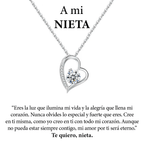 Un collar de plata en forma de corazón Amor eterno de acero inoxidable con un colgante de diamantes aparece sobre un cariñoso mensaje en español para una nieta, expresando ánimo y afecto eterno-un regalo ideal para mujer.
