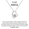 Un collar de plata en forma de corazón Amor eterno de acero inoxidable con un colgante de diamantes aparece sobre un cariñoso mensaje en español para una nieta, expresando ánimo y afecto eterno-un regalo ideal para mujer.