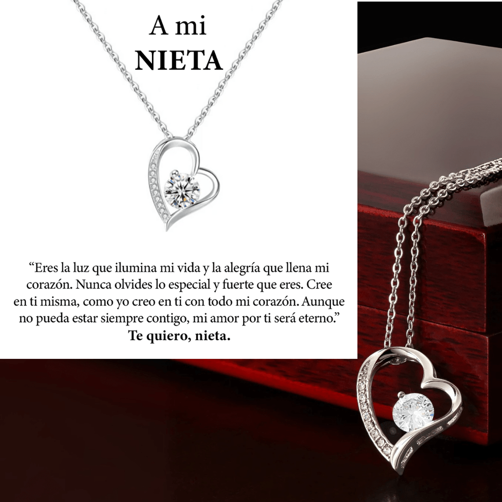 El collar Amor eterno es un collar de acero inoxidable en forma de corazón con una pieza central de cristal sobre una cadena, presentado en una caja de madera oscura. Incluye un texto en español de amor y ánimo para una nieta-regalo para mujer, firmado Te quiero, nieta.