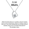 El Collar Amor Eterno de acero inoxidable con dije de corazón y gema se presenta sobre un mensaje en español para una hija, expresando amor, fe y orgullo. Un regalo especial e inolvidable para mujer.