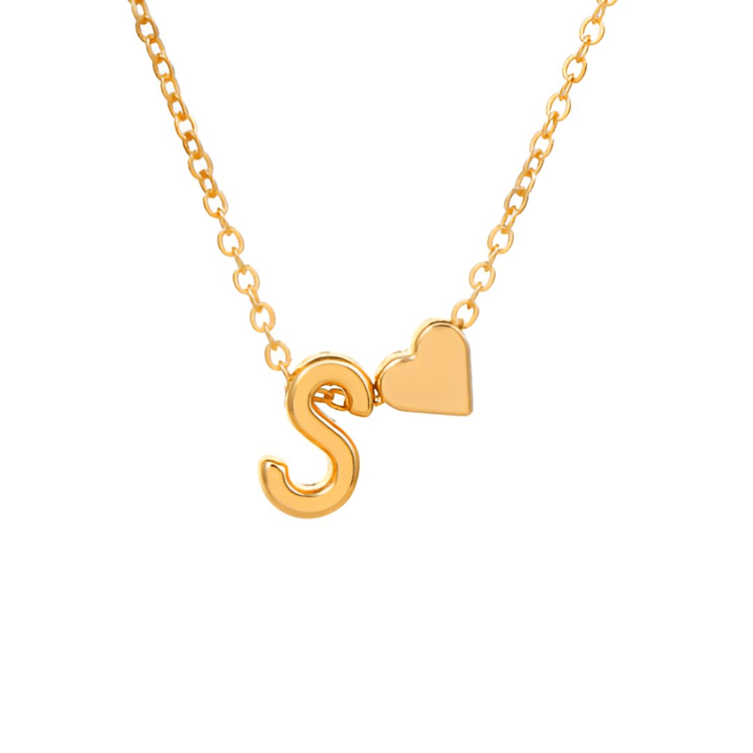 Collar con inicial y corazón: un collar de cadena dorada con una letra S y un pequeño dije de corazón, perfecto como regalo personalizado.
