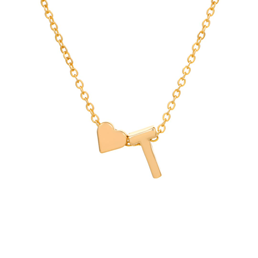 Collar con inicial y corazón: un collar de cadena dorada con un charm de corazón junto a una letra T mayúscula, ideal como regalo personalizado.