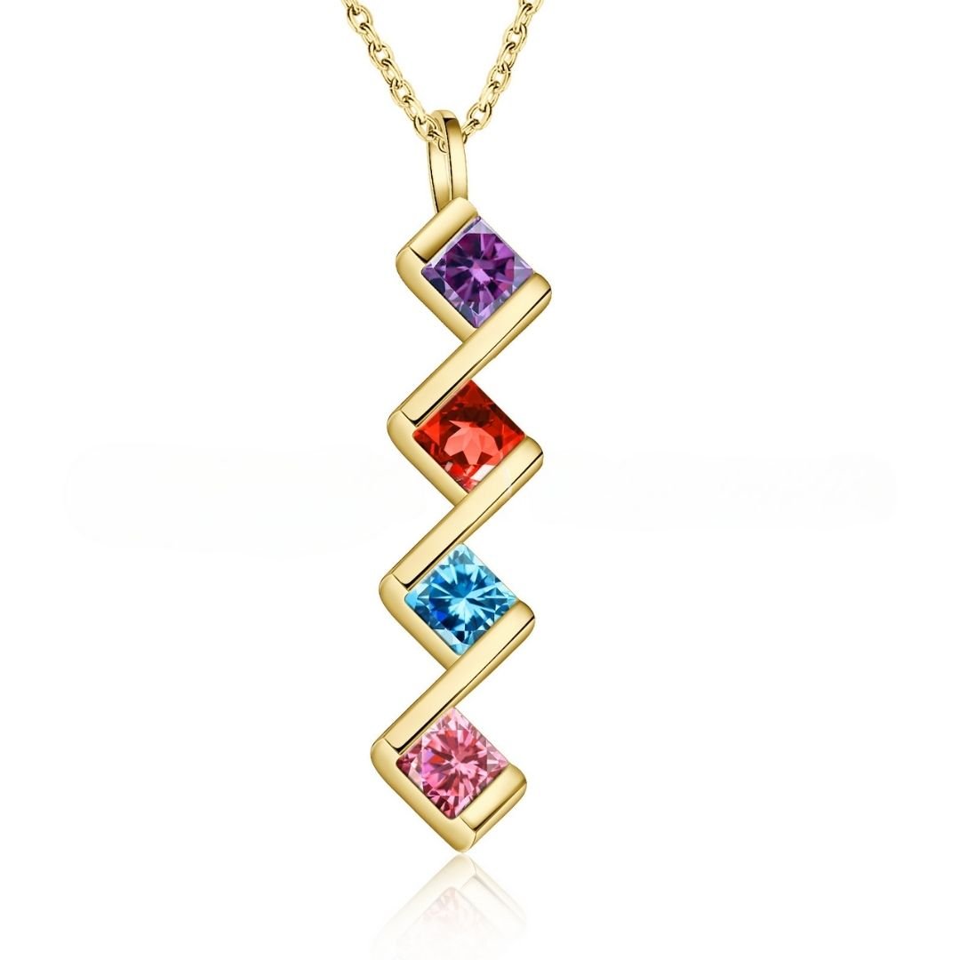 Collar con múltiples piedras de nacimiento: un collar dorado con diseño en zigzag y cuatro gemas cuadradas en morado, rojo, azul y rosa. Ideal como collar personalizado o regalo para mamá que celebra piedras de nacimiento especiales.