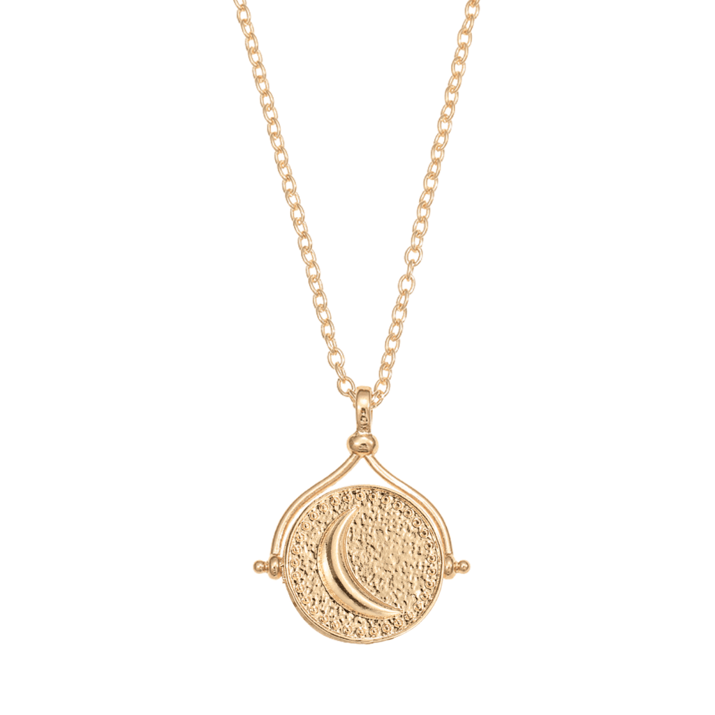 El collar giratorio Sol y Luna "Hatha" es un collar de oro con un colgante redondo texturizado con una luna creciente en relieve, inspirado en el icónico collar Sol y Luna y suspendido de una delicada cadena.