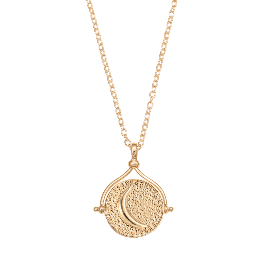 El collar giratorio Sol y Luna "Hatha" es un collar de oro con un colgante redondo texturizado con una luna creciente en relieve, inspirado en el icónico collar Sol y Luna y suspendido de una delicada cadena.
