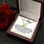 El collar "Mi carta de amor" se muestra en un joyero rojo junto a una rosa, con una tarjeta en su interior que contiene un sentido mensaje en español que termina en TE AMARÉ POR SIEMPRE Y TODA LA VIDA, lo que lo convierte en el regalo perfecto para su esposa.