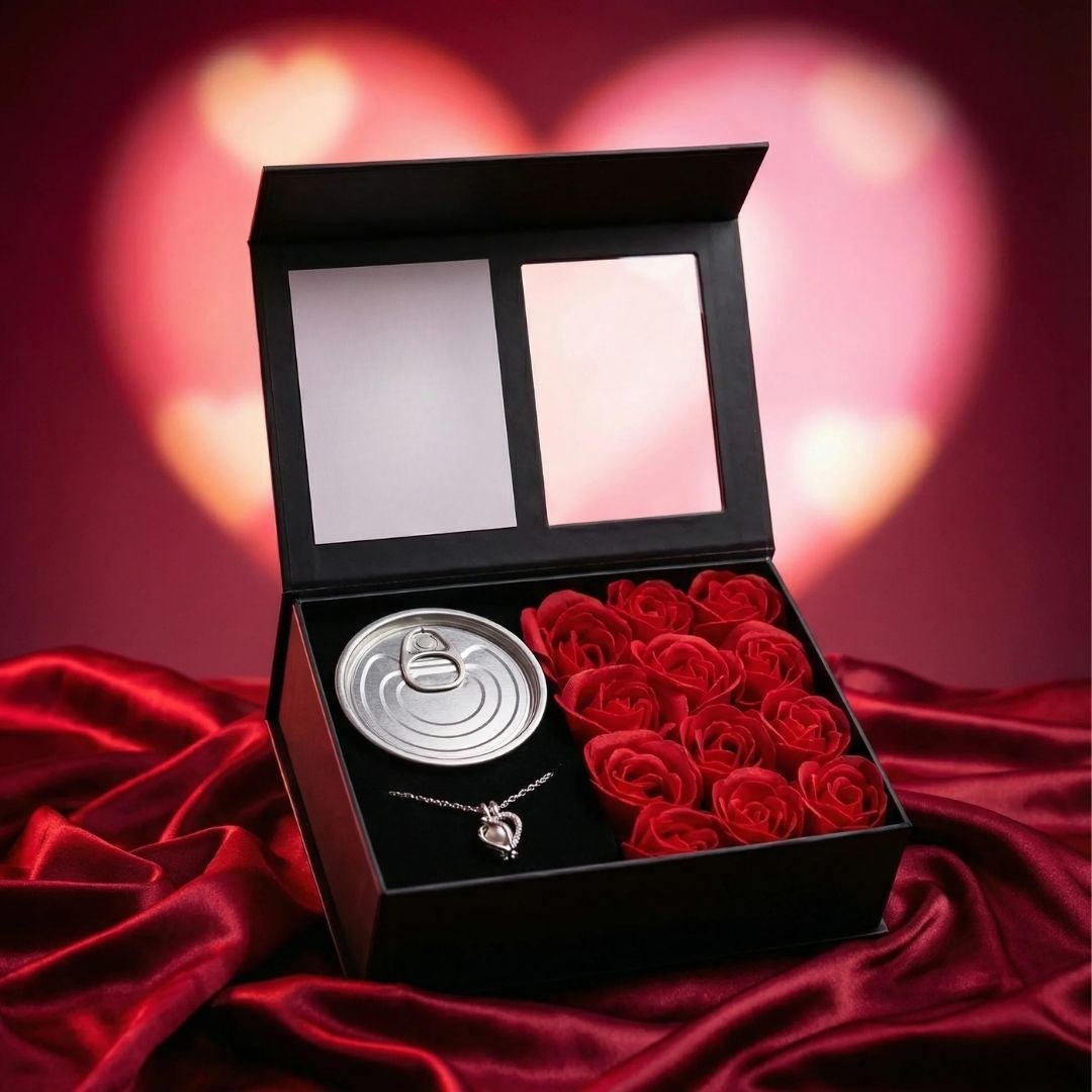La Experiencia Perlitta - Ostra real incluye artículos en forma de rosa, un collar de plata con perla auténtica y una lata en un estuche de regalo negro sobre satén rojo con fondo de corazón brillante para un regalo experiencial inolvidable.