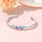 Pulsera con piedras natales y nombres grabados