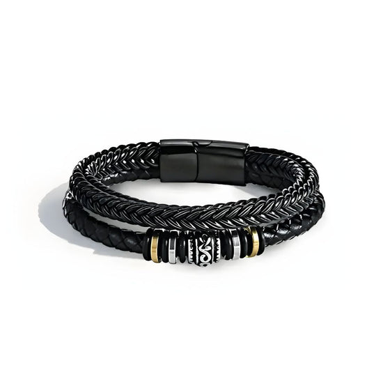 Pulsera de cuero - Siempre contigo Papá: brazalete de cuero hombre con dos bandas trenzadas negras, detalles en cadena plateada, toques dorados y cierre magnético negro. Pulsera ideal como regalo para papá o padres, mostrada sobre fondo blanco.
