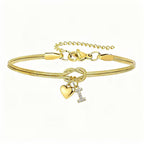 Pulsera dorada con inicial y dije de corazón - Moroveta