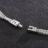 Un primer plano de la Pulsera grabada - A mi amor, una pulsera de plata personalizada con cierres etiquetados JOSH y LILY, desplegada sobre negro texturizado-un regalo ideal para hombre.