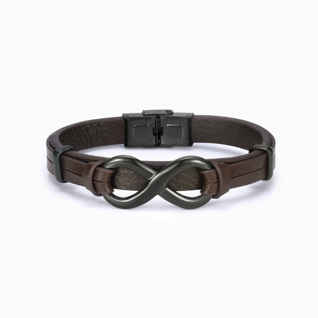 La Pulsera Infinito - A mi Hombre es de cuero marrón con símbolo infinito en metal negro y cierre negro, mostrada sobre fondo blanco-ideal como pulsera infinito y regalo para hombre.